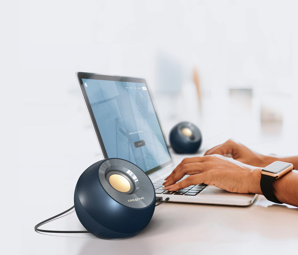 Black Creative Pebble V2 USB-C Desktop Speakers with Gain Switch — lifestyle